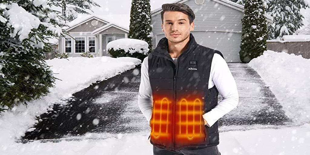 A man wearing a heated vest in the snow.